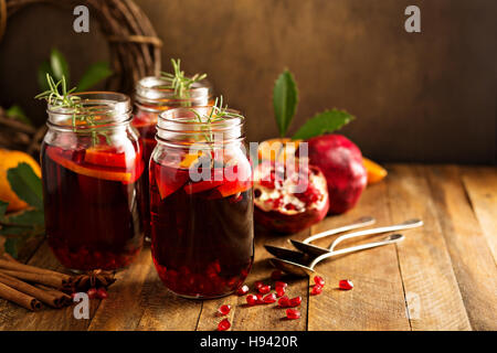 Pomegranate and orange winter cocktail Stock Photo