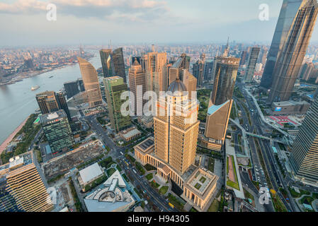 Wide angle view from the Oriental Pearl TV Tower to Shanghai Cityscape aside the Huangpu river at sunset, China. Stock Photo