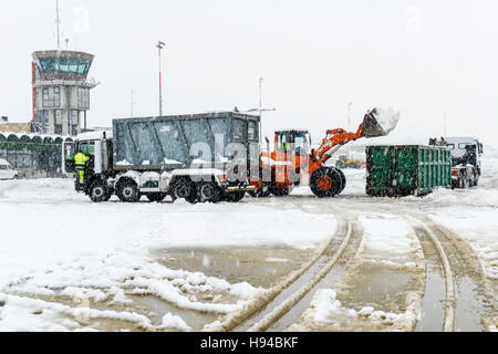 Lugano Agno,  Switzerland - 5 March 2016 - workers who clean the airport runway at Lugano/Agno on Switzerland from the snow Stock Photo