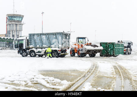 Lugano Agno,  Switzerland - 5 March 2016 - workers who clean the airport runway at Lugano/Agno on Switzerland from the snow Stock Photo