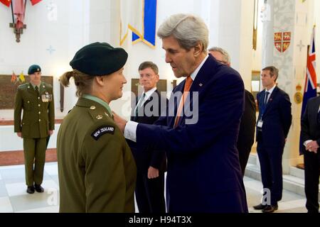 U.S. Secretary of State John Kerry presents a U.S. medal to a member of New Zealand's armed forces who served alongside American troops, during a visit to the Hall of Memories at the Pukeahu National War Memorial Park at Anzac Square in Wellington, New Zealand, on November 13, 2016. Stock Photo