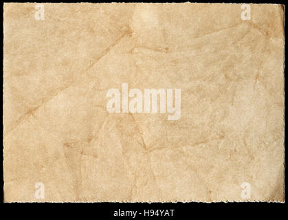 Old stained paper isolated on a black background. Stock Photo