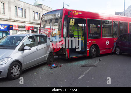 Wimbledon London, UK. 19th Nov, 2016. Police and emergency services attend to the scene following a Bus collision with several cars on Wimbledon town centre on a busy shopping day although there were no reports of any injuries Credit:  amer ghazzal/Alamy Live News Stock Photo