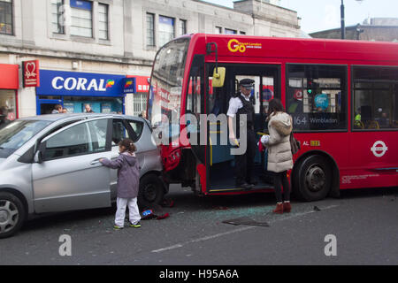 Wimbledon London, UK. 19th Nov, 2016. Police and emergency services attend to the scene following a Bus collision with several cars on Wimbledon town centre on a busy shopping day although there were no reports of any injuries Credit:  amer ghazzal/Alamy Live News Stock Photo