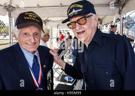 Miami Beach Florida,Veterans Day,celebration activities,Korean War Veteran,senior seniors citizen citizens,friends,talking,reminiscing,FL161113027 Stock Photo