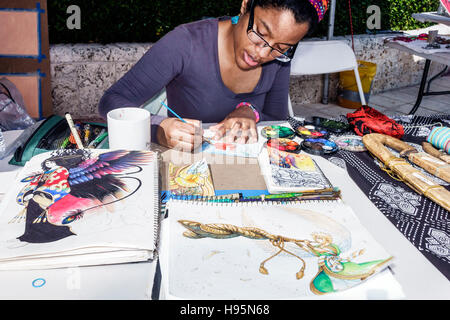 Miami Florida,Downtown Miami River waterwalk Festival,Black Blacks African Africans ethnic minority,adult adults,woman women female lady,artist,painti Stock Photo