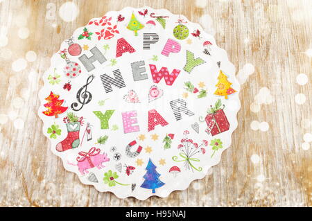 Decoupage New Year decorations made of paper on a plate Stock Photo