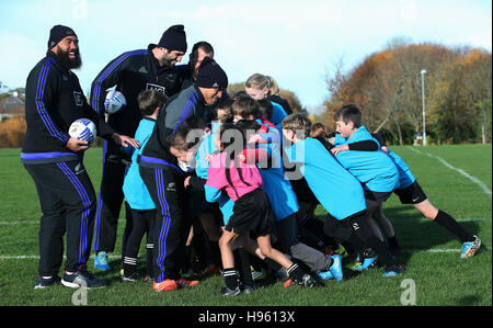 All Blacks' (from left) Charlie Faumuina, Sam Whitelock and Aaron Smith with club members during a visit to Seapoint Rugby Club, Co. Dublin, for a Rugby minis masterclass, in support of UNICEF???S right to play campaign. Stock Photo