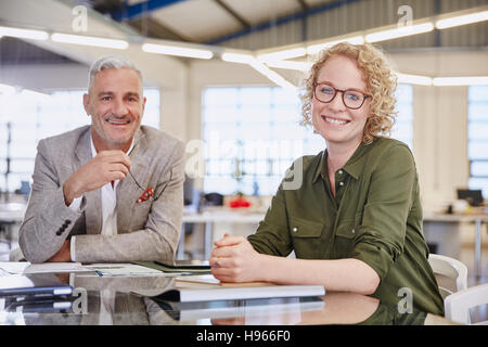 Portrait smiling business people in meeting Stock Photo