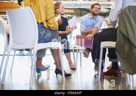 Business people talking in meeting circle Stock Photo