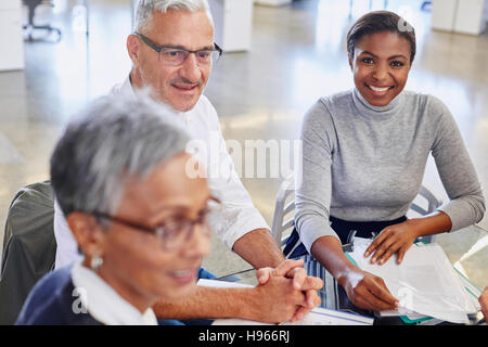 Smiling business people in meeting Stock Photo