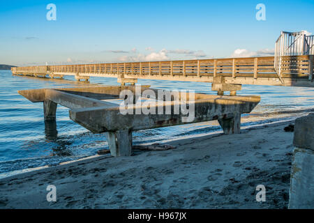 A view of the fishing pier in Dash Point, Washington at high tide. Stock Photo