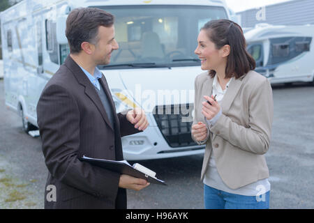 female driver holding happy to get driving results Stock Photo