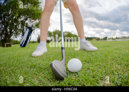 close up of golf ball on green field Stock Photo