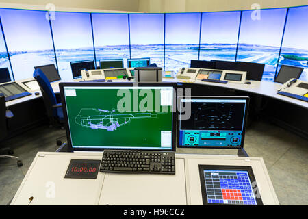 Air traffic controllers at work in the flight control tower at Sofia's airport. Computer monitors. Air traffic control directs aircraft on the ground  Stock Photo