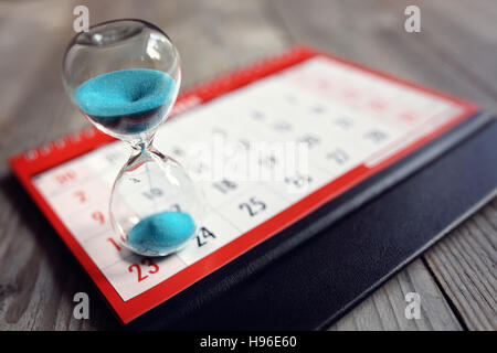 Hourglass on calendar Stock Photo