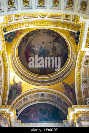 The painted semi-dome of St Isaac's Cathedral, surrounded by gilt carved patterns Stock Photo