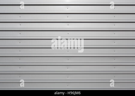 Silver corrugated metal with bolts, horizontal orientation Stock Photo