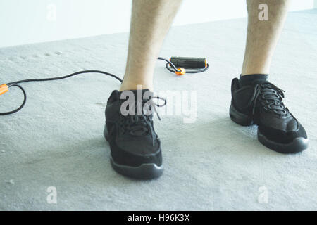 Performing exercises with resistance rope fitness Stock Photo