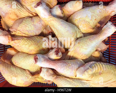 Raw chicken legs or chicken thigh on display selling at fresh market Stock Photo