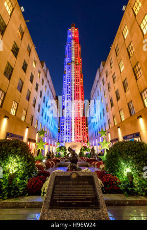 Rockefeller Center at twilight illuminated in white, red and blue. Midtown Manhattan, New York City
