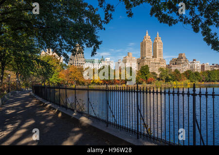 Upper West Side with colorful fall foliage across Jacqueline Kennedy Onassis Reservoir. Central Park West. New York City Stock Photo