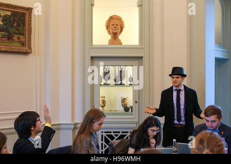 Students taking part in sessions at OxIMUN 2016 in Somerville College (with a bust of Margaret Thatcher in the background). From a series of photos ta Stock Photo