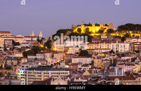 Cityscape of Lisbon, Portugal, with the Sao Jorge Castle seen from Miradouro Sao Pedro de Alcantara at night. Stock Photo