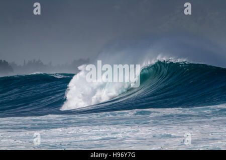 Breaking Ocean wave at Waimea bay on the north shore of Oahu Hawaii Stock Photo