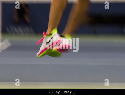 blurred feet of a professional tennis player at the US Open 2016 Stock Photo