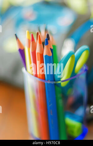 Colorful pencils in a transparent plastic cup Stock Photo