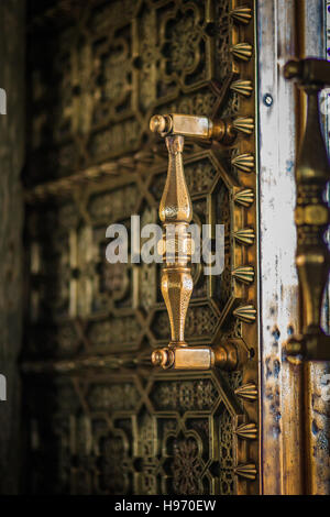 Close up of an old antique metal door with retro handle Stock Photo