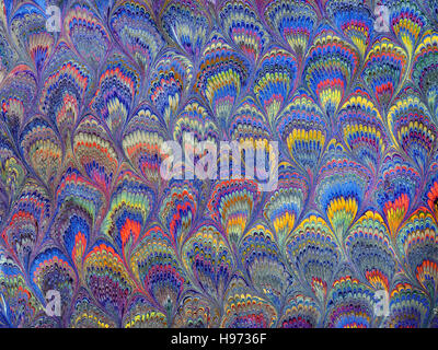 Hand made marbled paper with peacock feathers pattern Stock Photo
