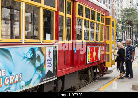 Passengers board an RTA streetcar on Canal Street in New Orleans, Louisiana. Stock Photo