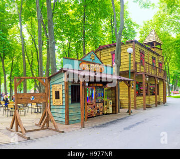 The stalls and cafes in Western style town in Central Park decorated as saloon, Sheriff's Office and Jail, Kharkiv, Ukraine Stock Photo