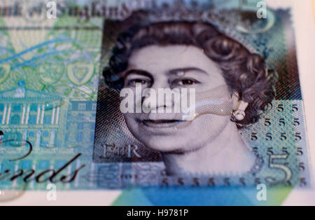 New polymer fiver pound note with water drop, London Stock Photo