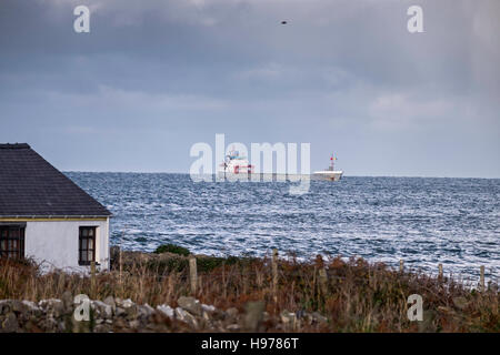 Moelfre Cottages Anglesey North Wales Uk. landscape. seascape ship. coaster. Stock Photo