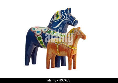 A more modern and blue Dala (Dalecarlian) Horse together with an old red worn Dala Horse, isolated on a white background. Stock Photo