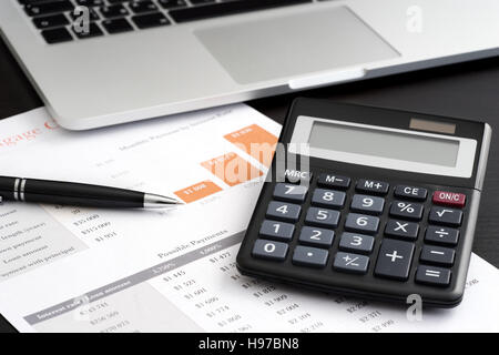 Financial paper charts and graphs on the table Stock Photo