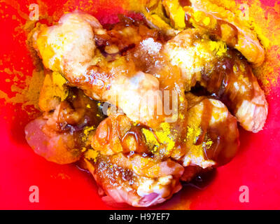 Raw chicken wings marinated with special and selected spice. Stock Photo