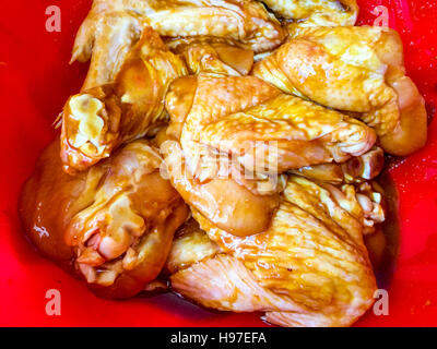 Raw chicken wings marinated with special and selected spice. Stock Photo