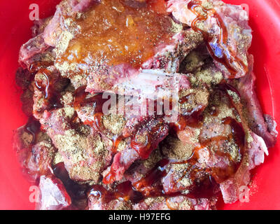 Raw Deer Meat or Venison ribs marinated with special and selected spice. Stock Photo