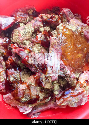 Raw Deer Meat or Venison ribs marinated with special and selected spice. Stock Photo