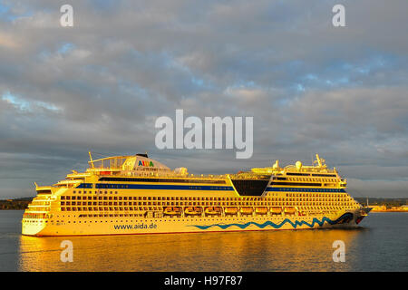 Luxury cruise liner AIDAblu enters Cork Harbour, Cobh, County Cork, Ireland at sunrise. Stock Photo