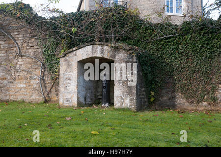 An old water pump in Hinton-in-the-Hedges village, Northamptonshire, England, UK Stock Photo