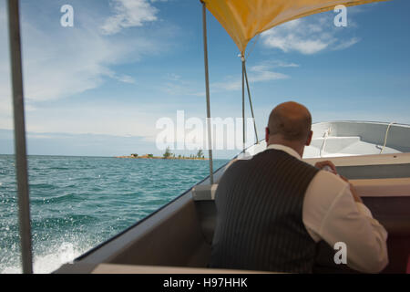 on a boat to an island in Belize sunny day blue skys Stock Photo