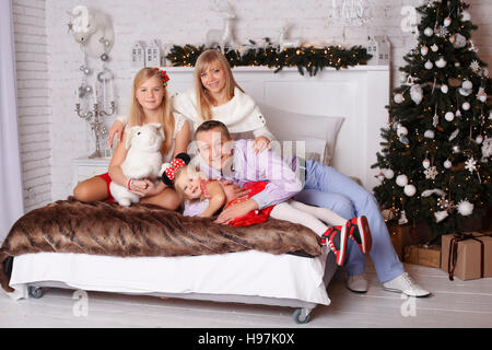 Happy family on Christmas Eve Stock Photo