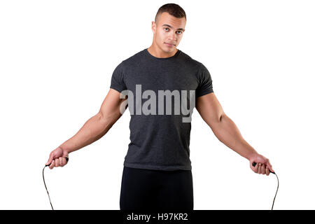 Sporty man with a jumping rope, isolated in white Stock Photo