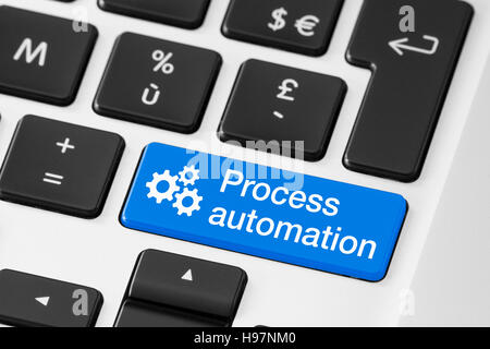 Process automation concept, close-up of button on computer keyboard, technology and business Stock Photo