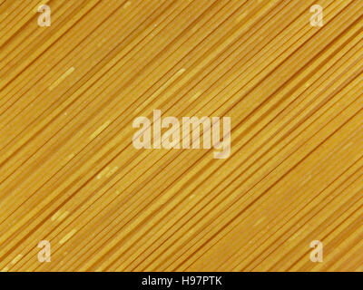 Close-up of uncooked whole wheat spaghetti, background, texture Stock Photo